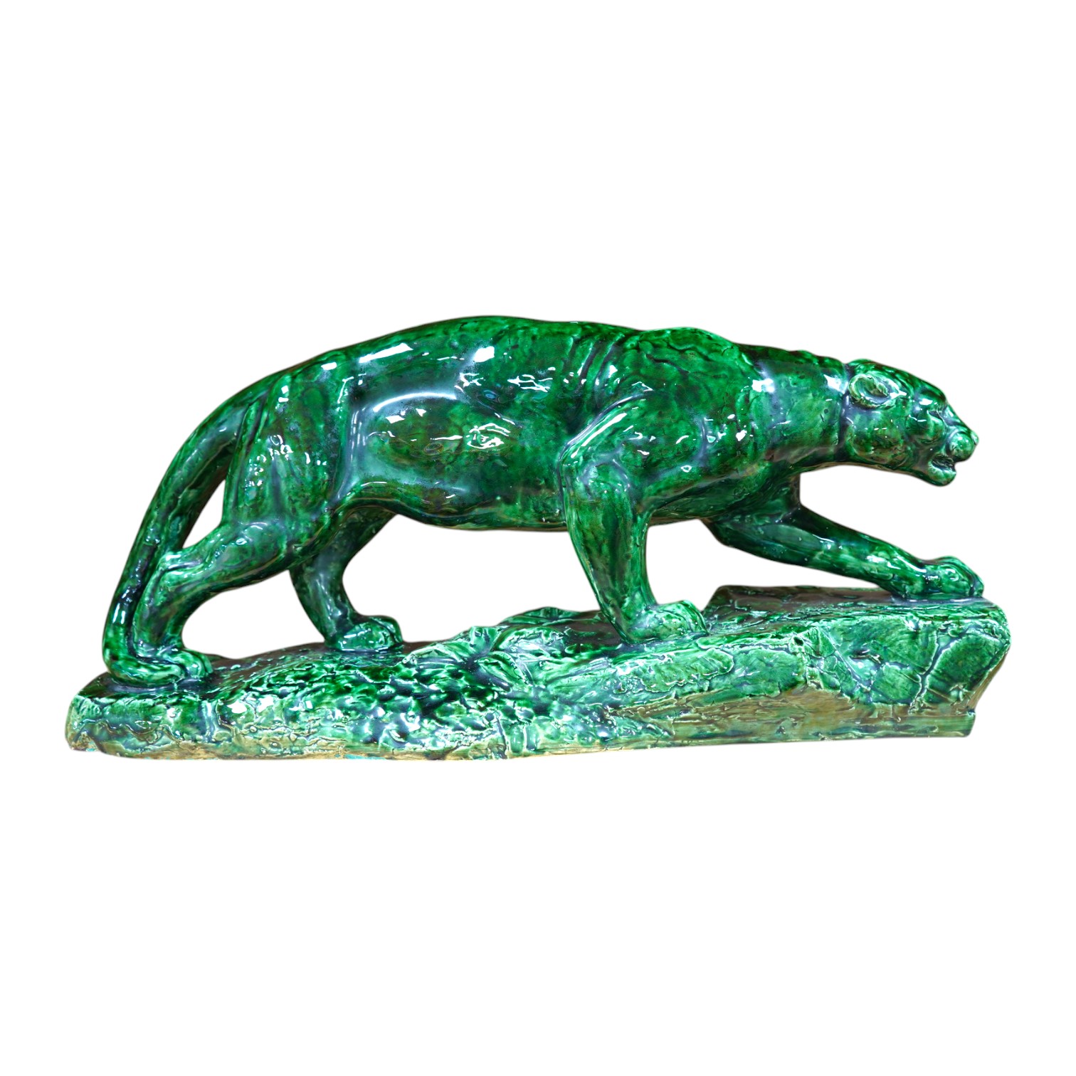 A French green glazed earthenware panther, indistinctly signed, 55cm wide. Condition - good